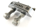 Yamaha XV 750 Virago [1991] - Headlight mount brake line distributor with emblem-2
